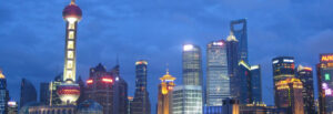 downtown area in China city at night with buildings illuminating in various colors Worldwide Sourcing & Solutions United States, China