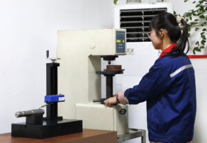 quality control specialist inspects parts for customers using testing machine Worldwide Sourcing & Solutions United States, China